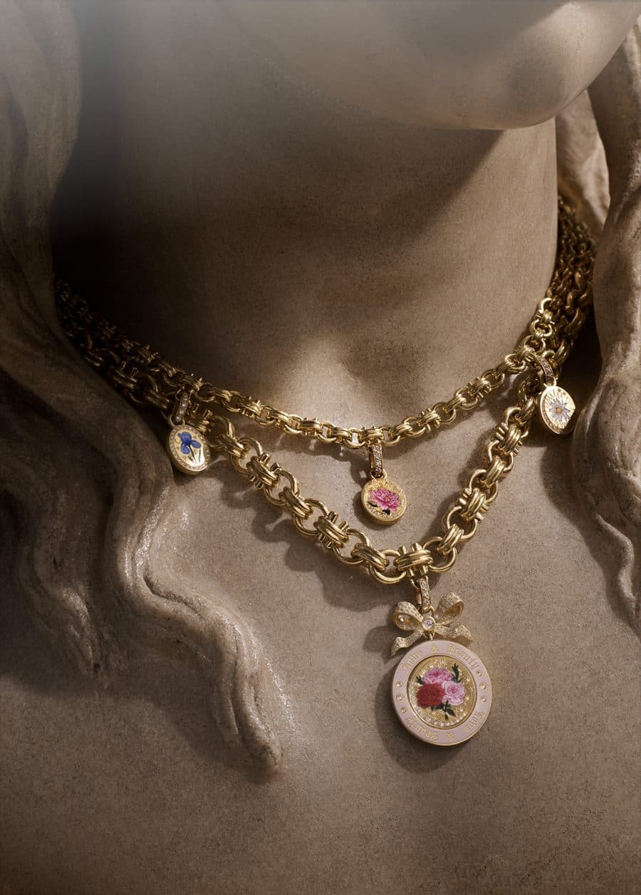 Layered Cece gold chains with enamel charms