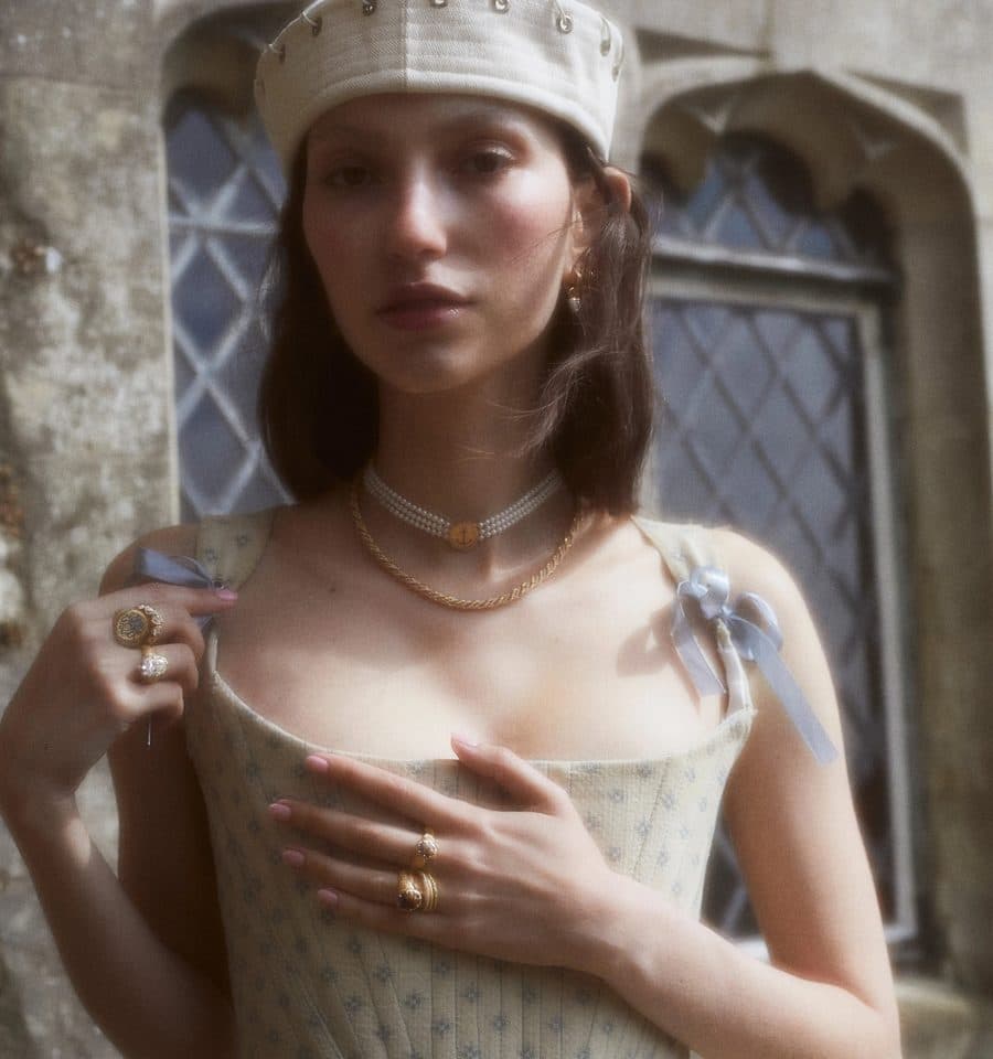 Model wearing Cece gold jewellery in a sailor-inspired look
